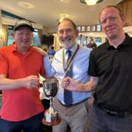 Men standing with Cup